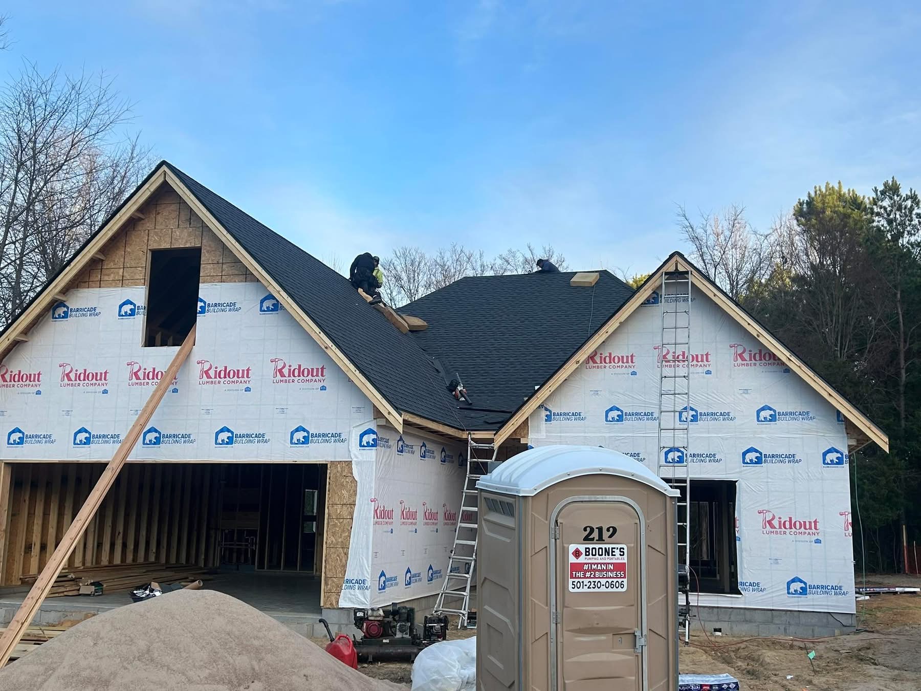 Roofing crew at work on an Arkansas home